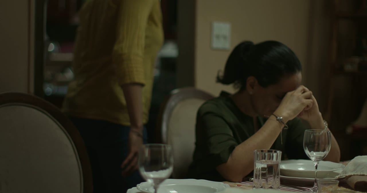 At the Table — scene still